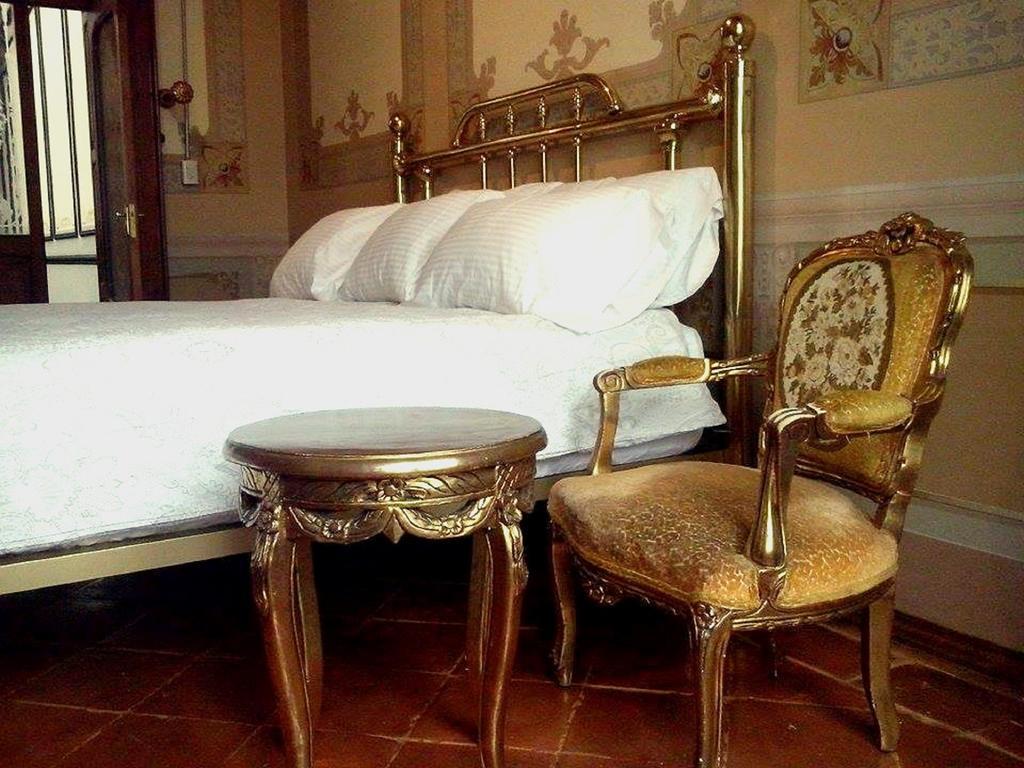 Leonora Hostal Puebla Rum bild